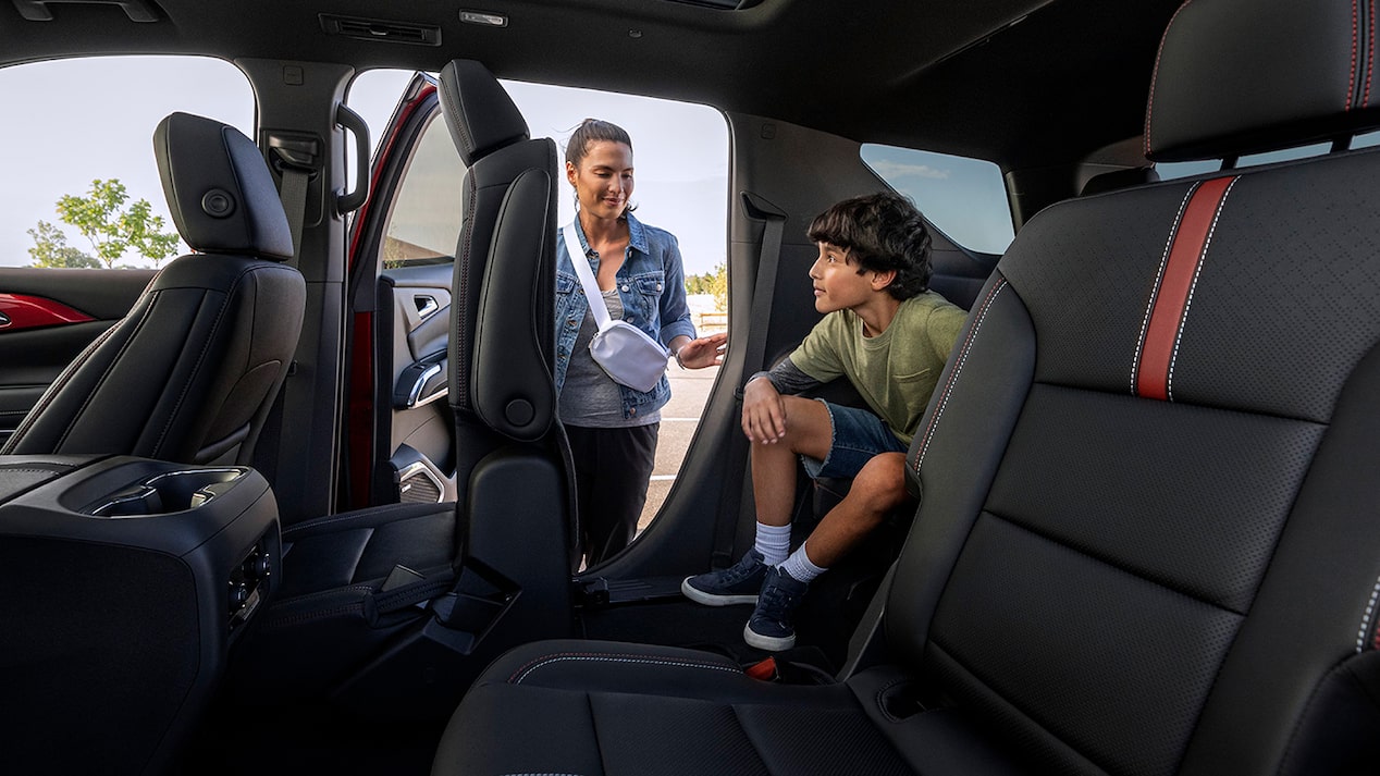 Interior view of a person about to enter the 2025 Chevrolet Traverse SUV.