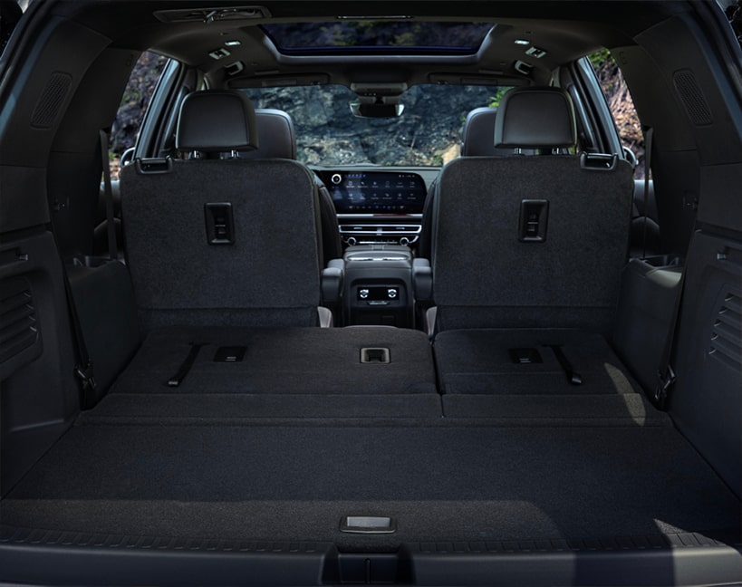 Back view of the interiors of the 2025 Chevrolet Traverse SUV with the rear row folded.
