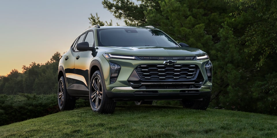 2025 Chevrolet Trax ACTIV parked on a grassy hill.