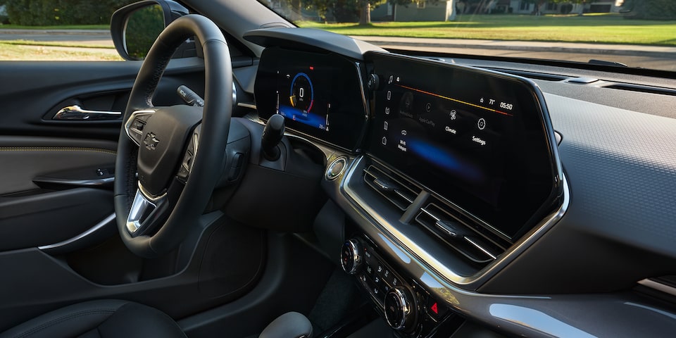 Dashboard and steering wheel overview of 2025 Chevrolet Trax.