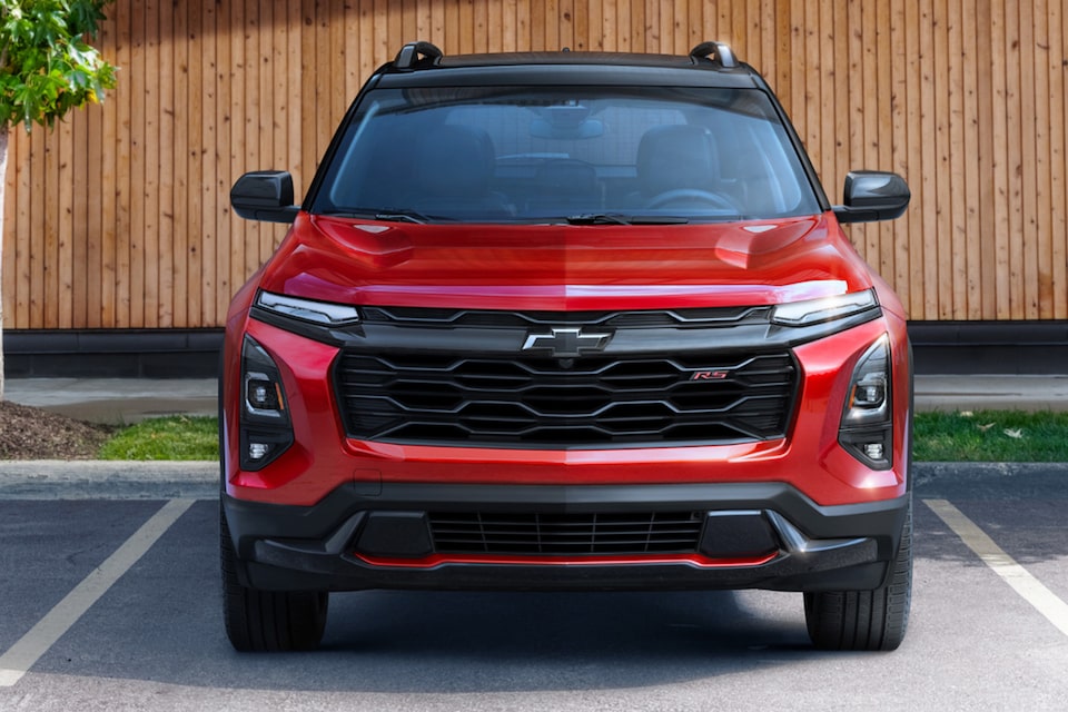 Front view of the 2025 Chevrolet Equinox compact SUV parked by the bamboo wall.