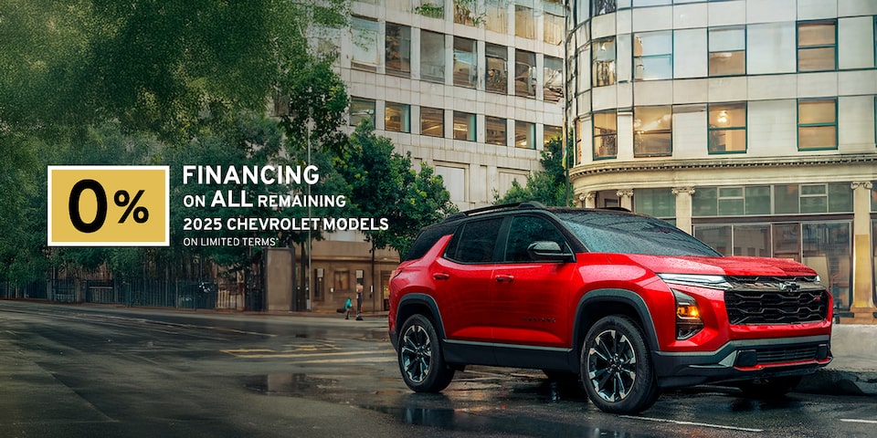 2025 Chevrolet Equinox compact SUV parked alone on a city street on a rainy day.