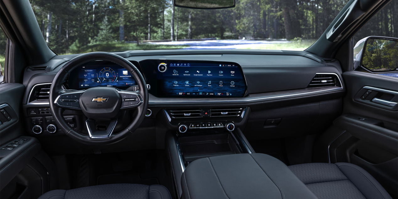 Driver's view of the Front Row and Dashboard inside the 2025 Chevrolet Tahoe SUV.