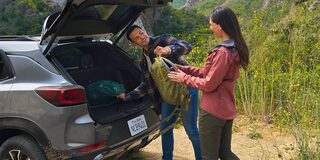 Couple Unloading Hiking Gear From Trunk of the 2025 Chevy Trailblazer