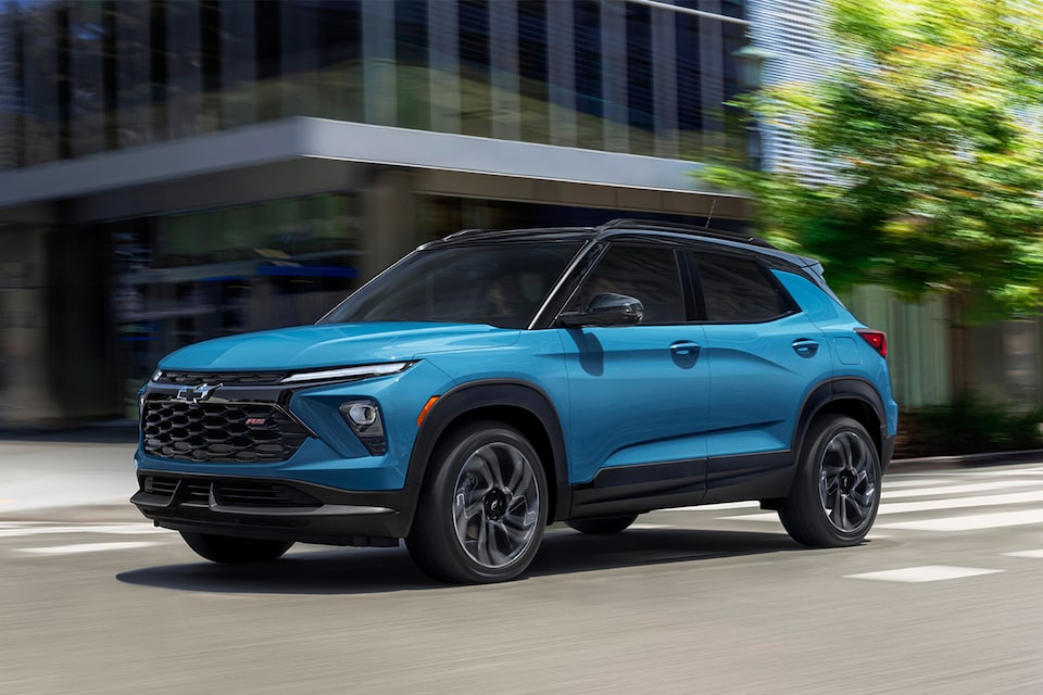 2025 Chevrolet Trailblazer driving through a city intersection.