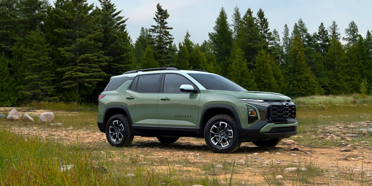 Front-side view of the 2026 Chevrolet Equinox parked in a grassy terrain.