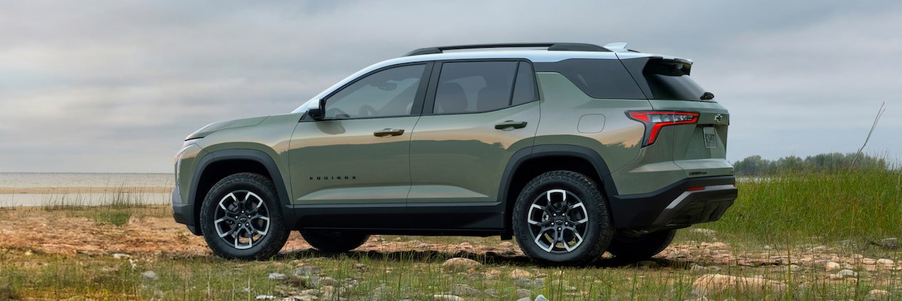 Side view of the 2026 Chevrolet Equinox parked in a grassy terrain.