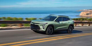 2026 Chevrolet Trax Speeding Over a Bridge Overlooking a Lake Below.