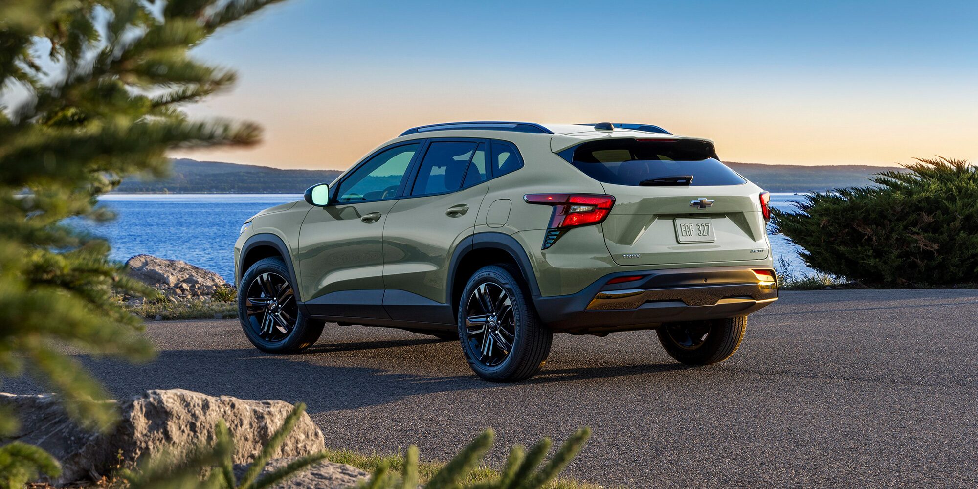 Back-side view of a 2026 Chevrolet Trax Parked Facing a Lake.