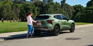 A person opening the Liftgate of the 2026 Chevrolet Trax.