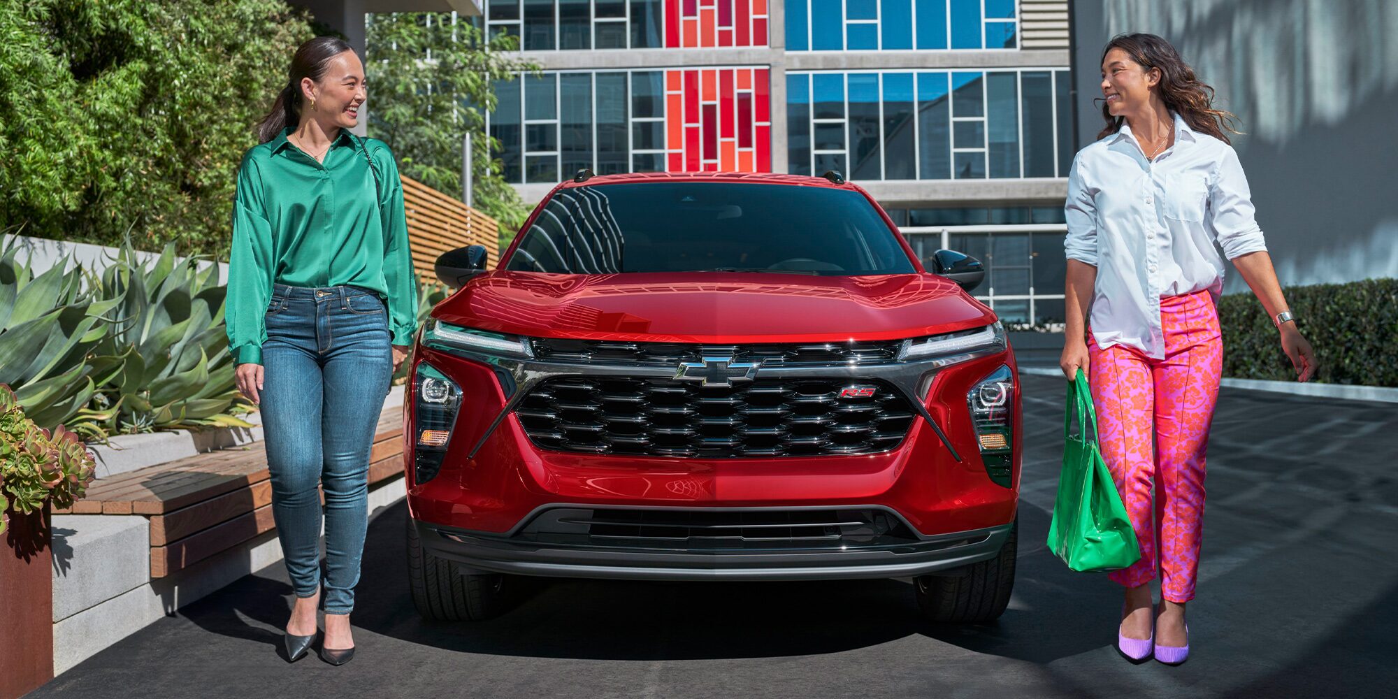 Two People Walking Away from Their Parked 2026 Chevrolet Trax.
