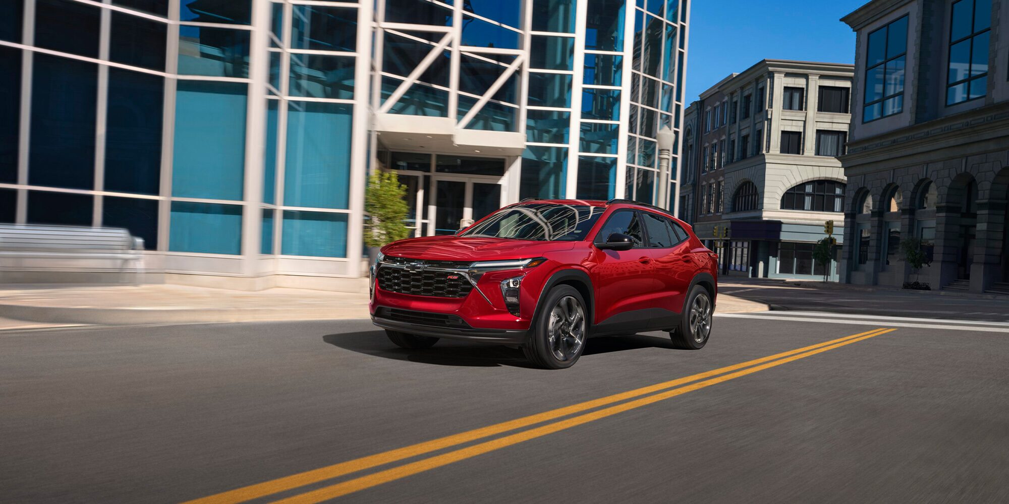 2026 Chevrolet Trax Driving Through a Downtown Road.