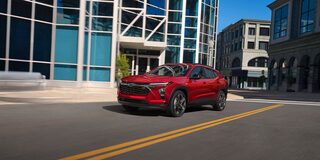 2026 Chevrolet Trax Driving Through a Downtown Road.