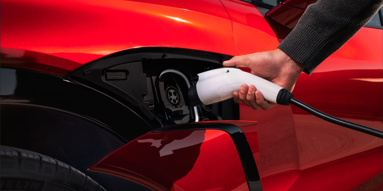 A person charging their 2026 Chevrolet Blazer EV.