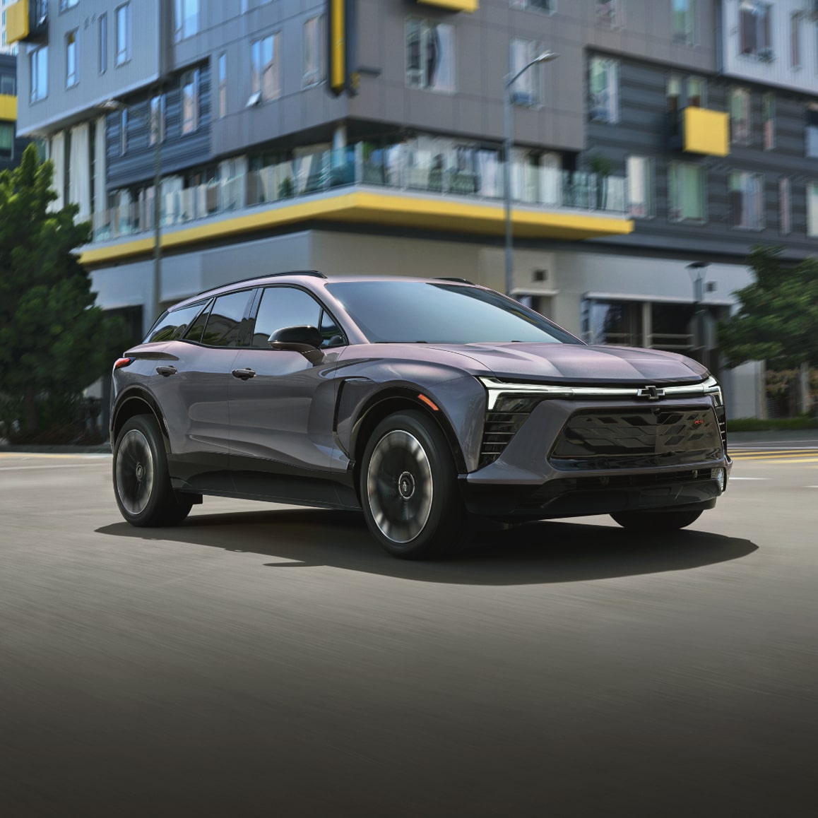2026 Chevrolet Blazer EV driving through an intersection.