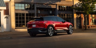 2026 Chevrolet Blazer EV driving past a building.