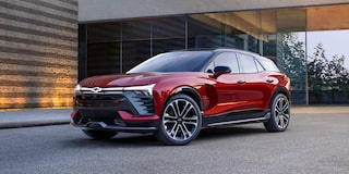 2026 Chevrolet Blazer EV parked in front of an office building.