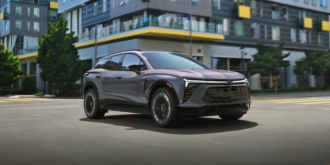2026 Chevrolet Blazer EV driving through an intersection.