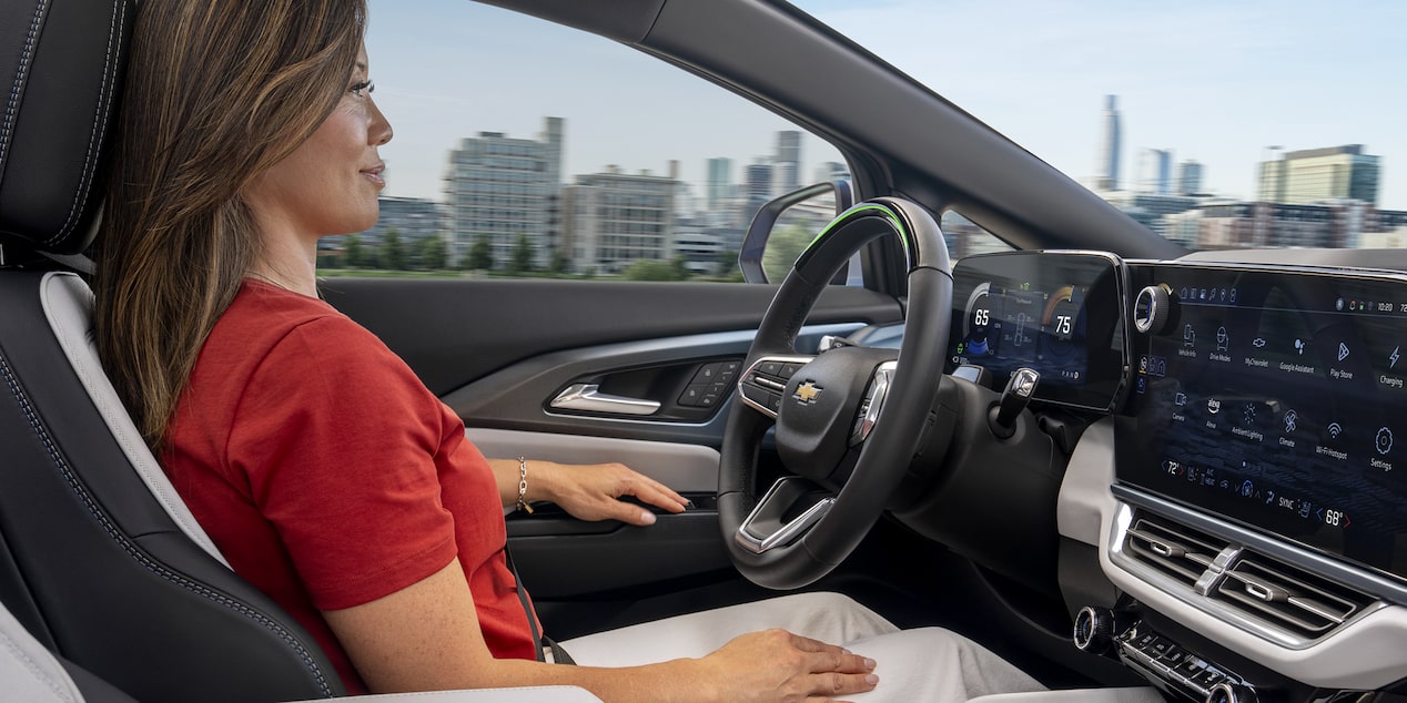 Woman Using Super Cruise Hands Free Driving Feature