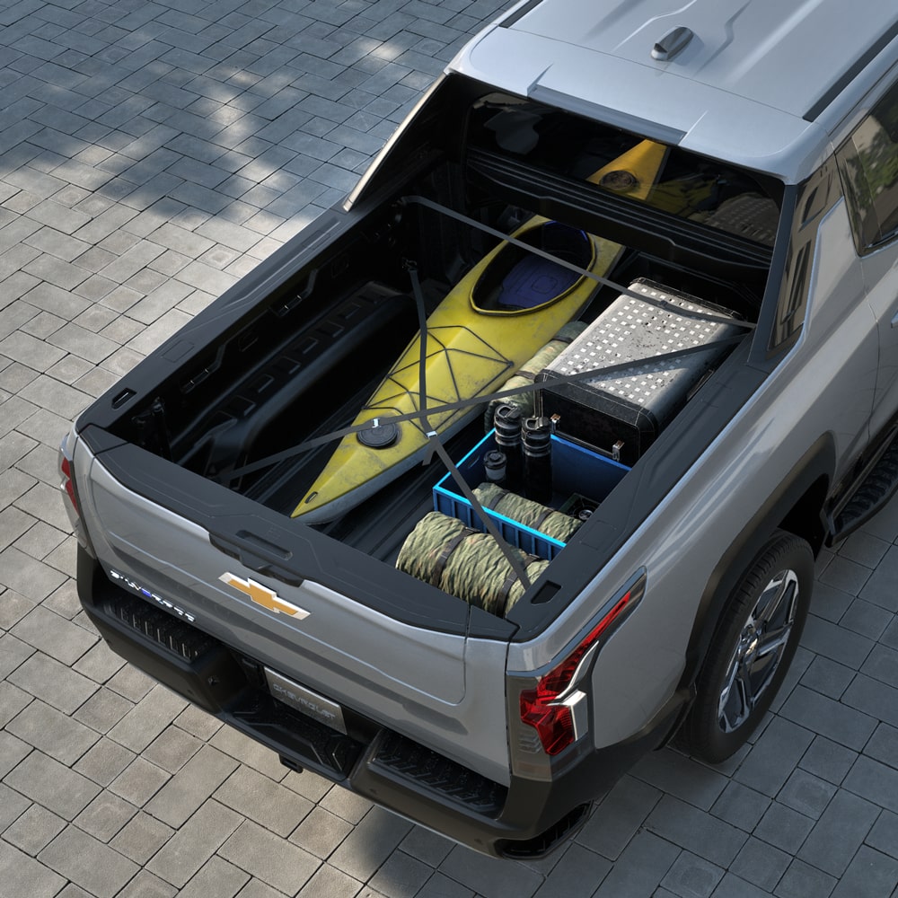 Camping gear stowed on the cargo bed of the 2026 Chevrolet Silverado EV.