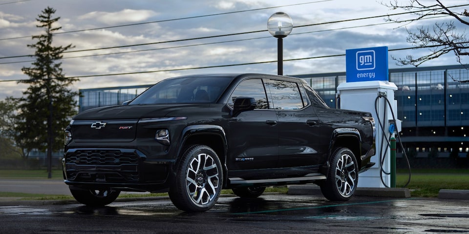 Chevrolet Silverado EV charging at a public charging station.