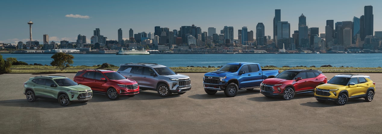 Multiple Chevrolet vehicles parked on a city environment for GM Discount Programs.