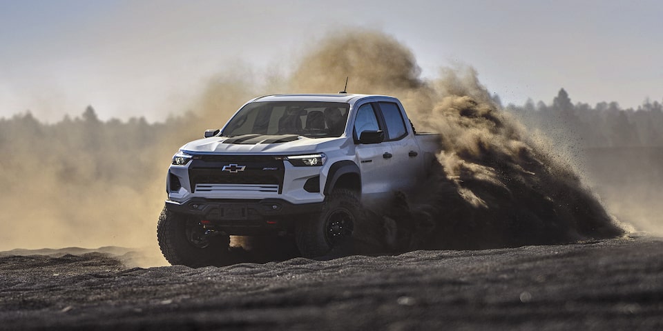 2025 Chevrolet Colorado skidding on a mountain terrain.