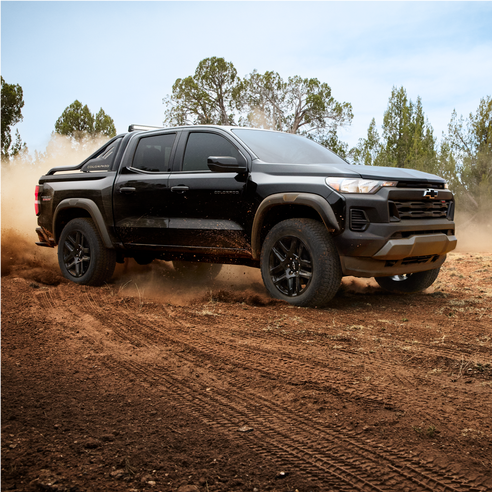 Chevrolet Colorado Trail Boss Driving Down a Dusty Road.