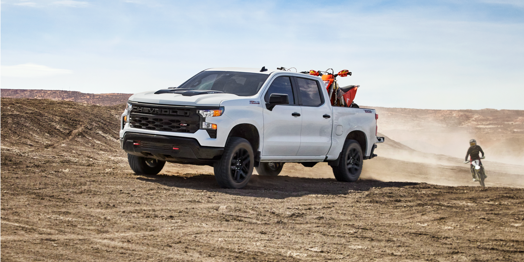 Chevrolet Silverado 1500 Trail Boss With ATV and Dirt Bikes Stored in the Truck Bed.