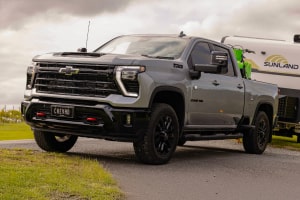 front 3/4 image of the silverado HD towing a caravan
