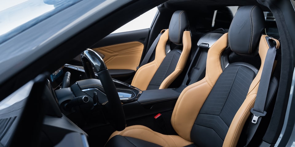 driver side view of two tone natural and jet black interior
