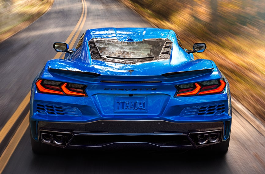 Rear Shot of blue Corvette E-Ray driving