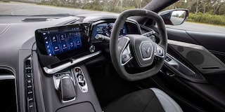 Driver side image of a two tone sky cool grey and black interior in a Corvette Stingray