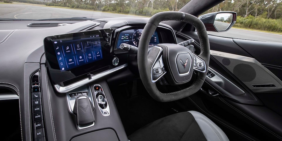 Driver side image of a two tone sky cool grey and black interior in a Corvette Stingray