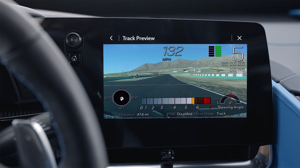 Paused image of the Corvette Stingray in front of the map from the front lift Corvette Academy video