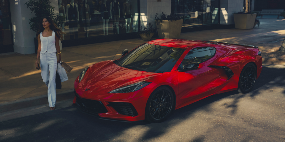 Torch Red Corvette Stingray driving on road