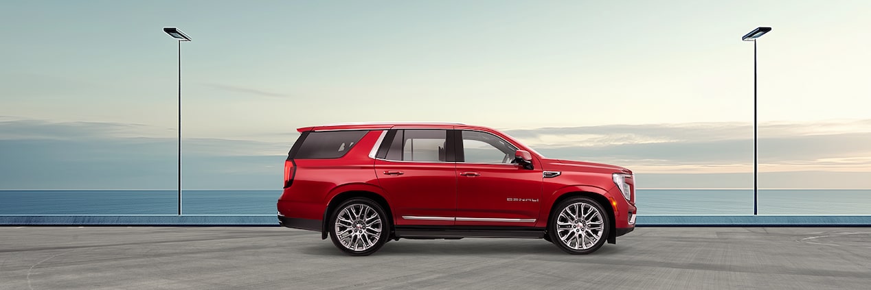 side profile image of the red Yukon Denali