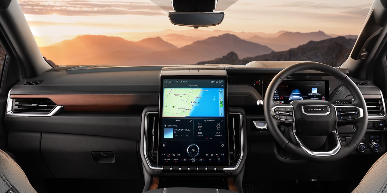 Steering wheel and infotainment screen of GMC Yukon Denali